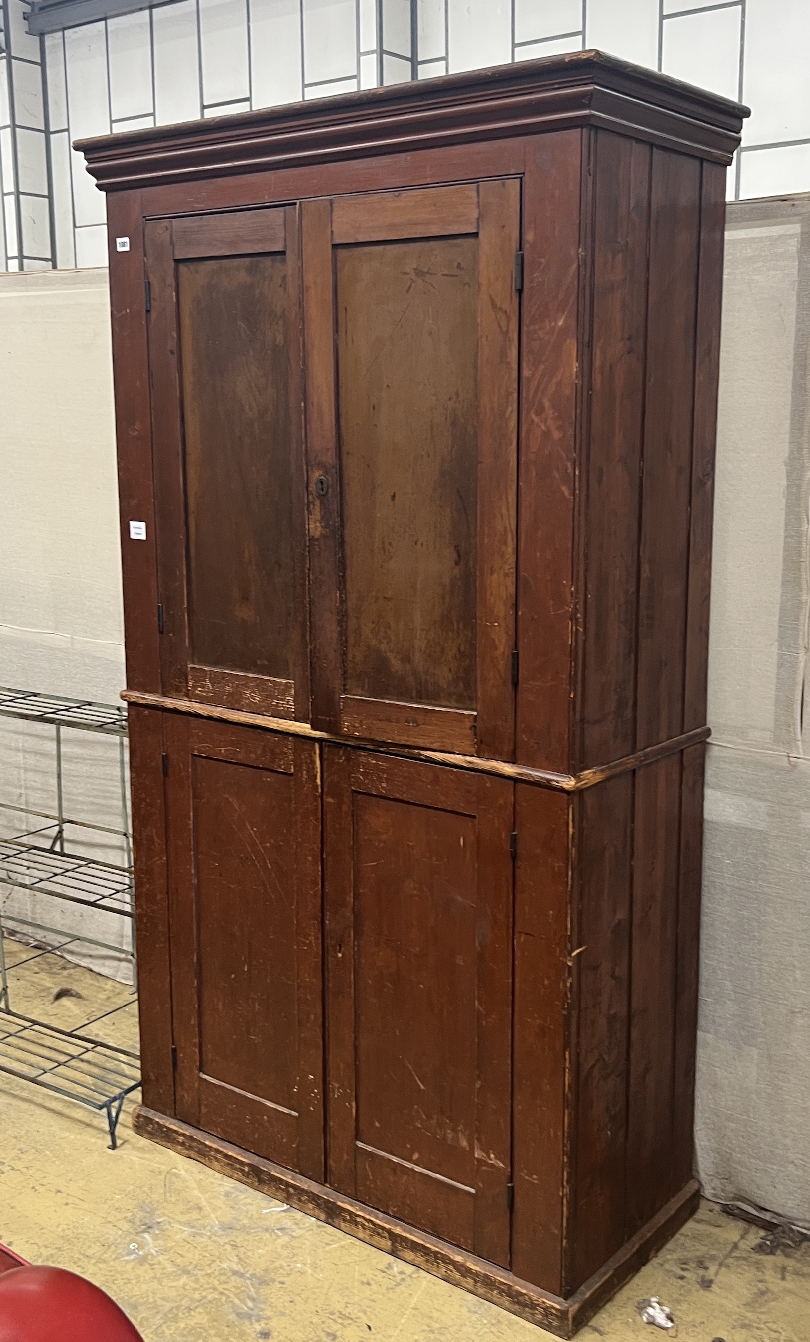 A Victorian pine four door household cupboard, width 109cm, depth 48cm, height 194cm